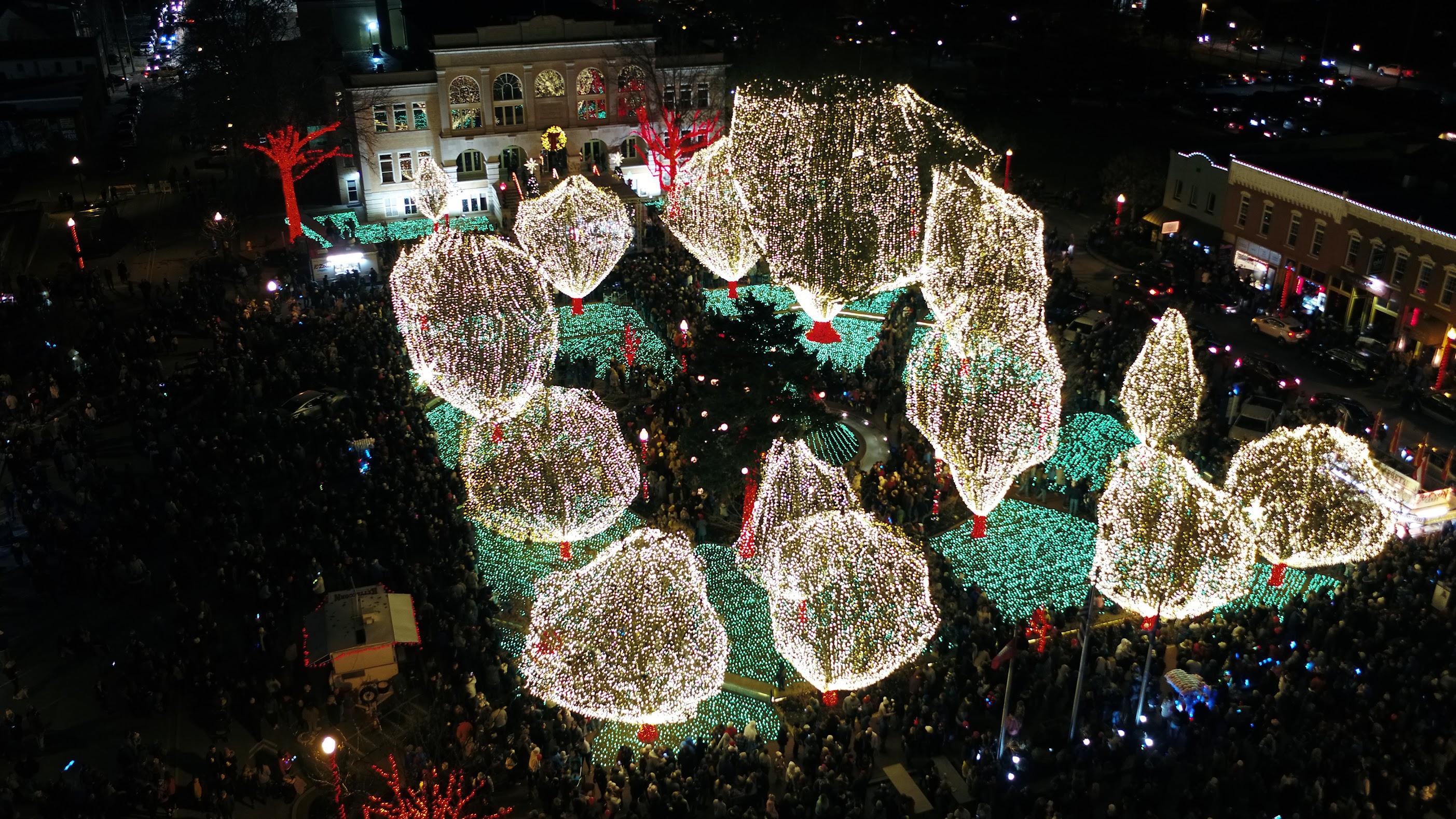 Archival nighttime aerial of Bentonville Square illuminated with Christmas lights